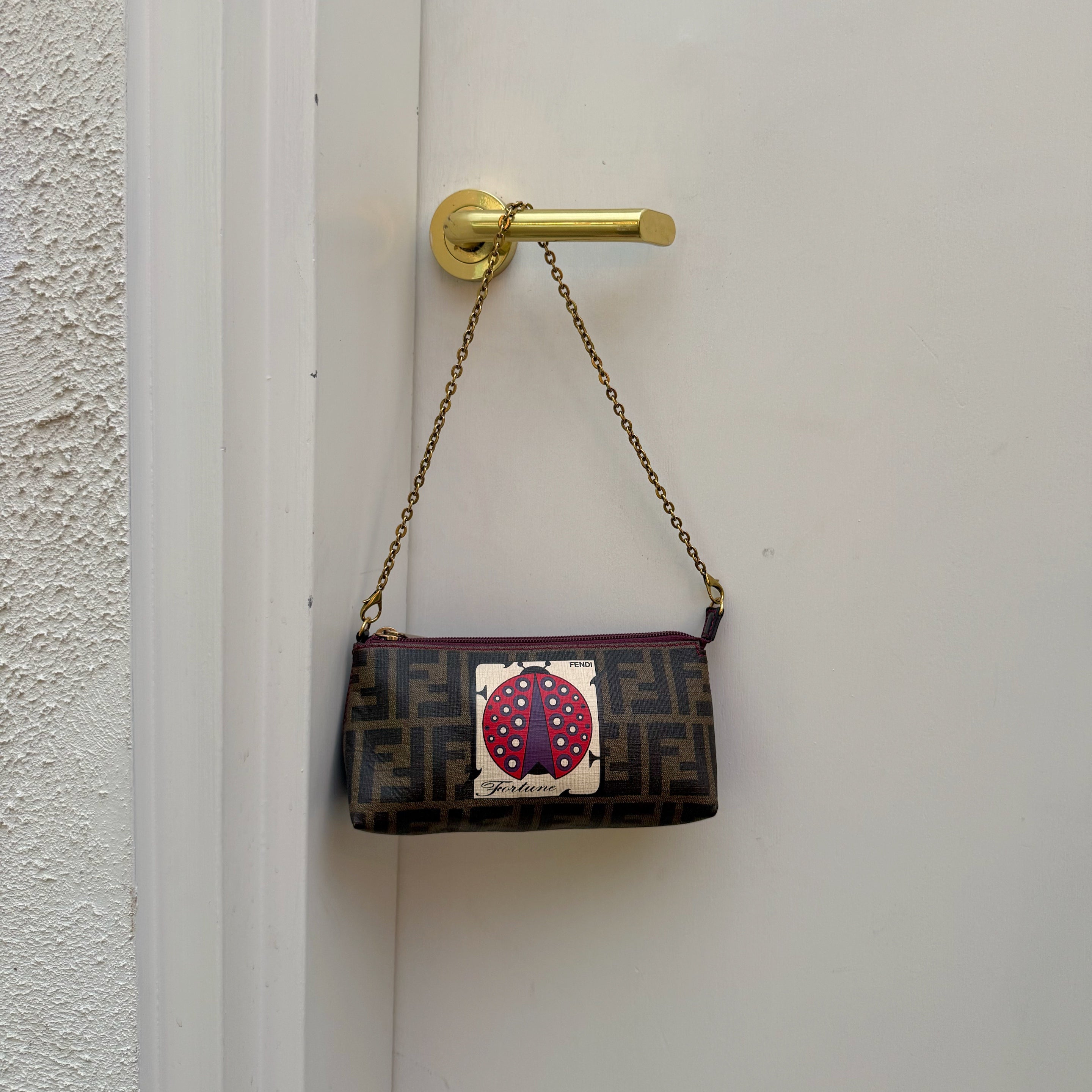 Fendi Limited Edition Zucca Spalmati Ladybug Pochette